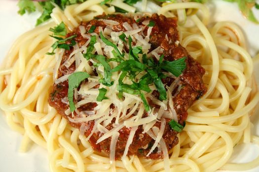 Piping hot bolognese sauce on spaghetti ready to eat.