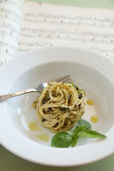 Delicious spaghetti with pesto ready to serve.