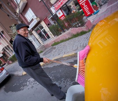 ANKARA, TURKEY ��� APRIL 15: Cab driver washes taxi prior to ANZAC day on April 15, 2012 in Ankara, Turkey.  Each year patriotic Turks honor those fallen at the battle of Galipoli during World War I.