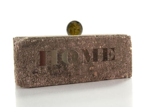 saving for home with euro and stone
