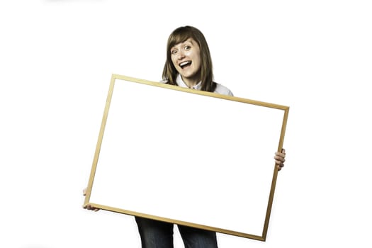 Happy young girl is holding a blank whiteboard