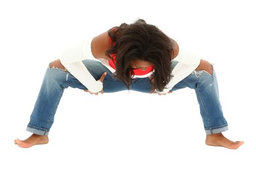 Fit black woman in torn jeans dancing hip hop barefoot on white. Clipping path.