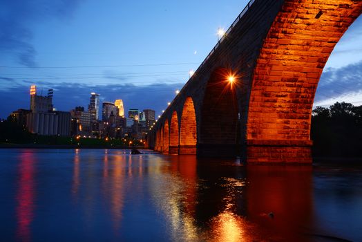 a historic bridge near minneapolis downtown in evening