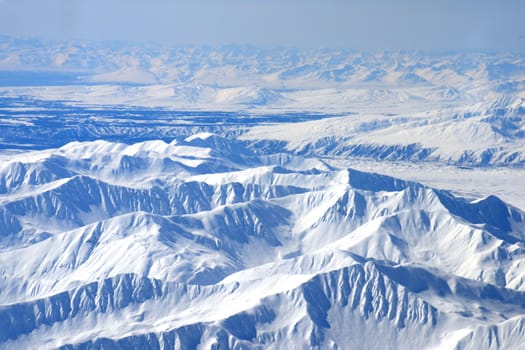 alaskan mountain as seen from bird eye view on a plane