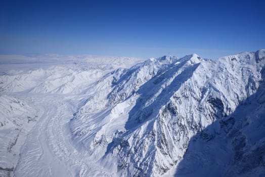 alaskan mountain cover with snow as seen from plane