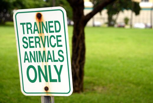 trained service animals only sign at park in summertime