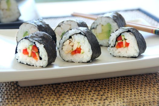 Delicious freshly rolled hicken sushi ready to serve.