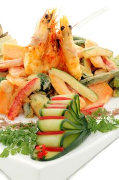 Japanese fried tempura with shrimp and vegetables with parsley garnish.