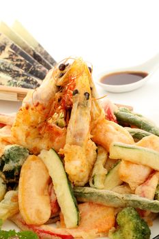 Japanese fried tempura with shrimp and vegetables with soy sauce.