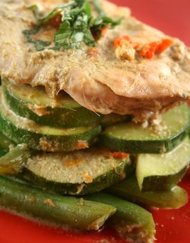 Delicious Thai green poached chicken with green beans and zucchini.