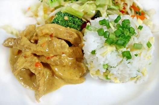 Delicious curried pork and rice with stirfry vegetables.