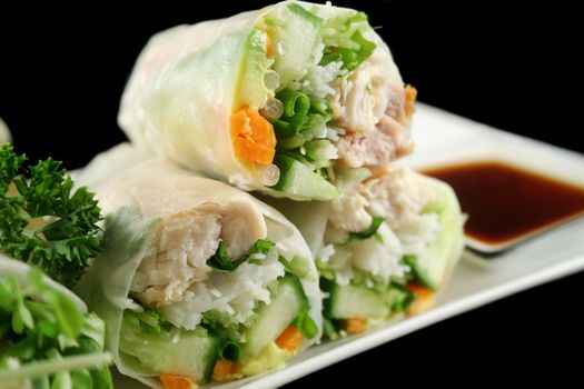 Delicious and healthy Vietnamese rice paper rolls with chicken and vegetables.