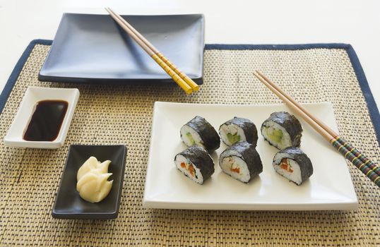 Chicken sushi with soy sauce and mayonnaise ready to serve.