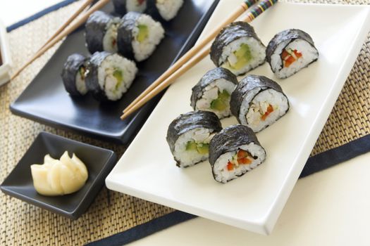 Chicken sushi with soy sauce and mayonnaise ready to serve.