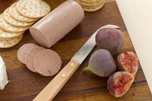 Delicious liverwurst and crackers with fresh figs picked from the garden.