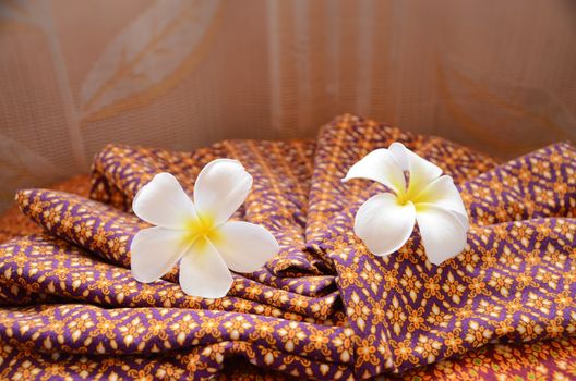 white flower and retro towel in spa