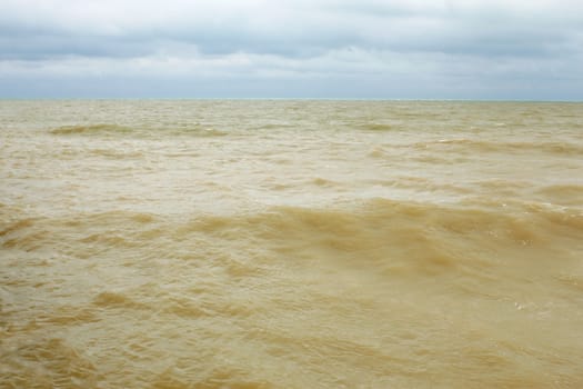 Coastal sea water after the storm contaminated dredged from the seabed sand