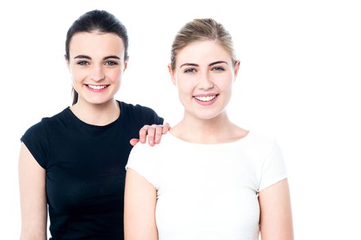 Two beautiful young girls posing to the camera