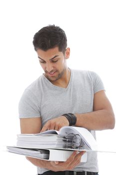 Young handsome man reading a pile of folder in a close up shot