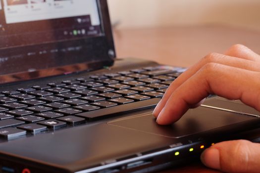 Closeup  touching notebook  keys during work