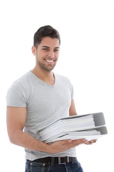 Smiling muscular man holding a pile of folders against the white background