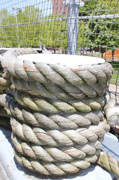 Coils of weathered rope on a ship.