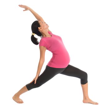 Prenatal yoga class. Full length healthy Asian pregnant woman doing yoga exercise stretching at home, fullbody isolated on white background. 