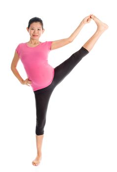 Prenatal exercise. Full length healthy Asian pregnant woman doing pilates exercise stretching at home, fullbody isolated on white background. 