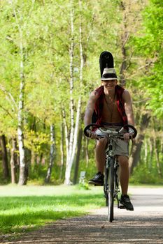 Young teenager is riding on his bicycle