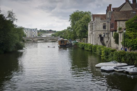 River Medway at Maidstone with boats, the bridge and the back of the Archbishops Palace