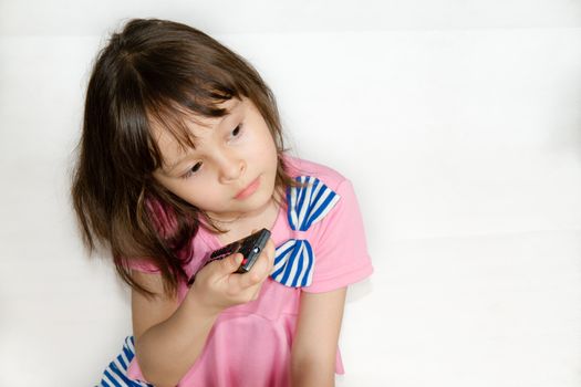 Asian child with remote control