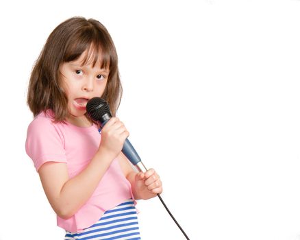Asian child singing into a microphone