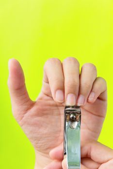 hand manicure with nail clipper