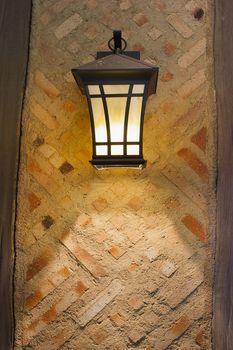 Craftsman Style Exterior Lamp on Exterior Wall of Old Tudor Style Home
