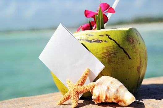 Coconut cocktail starfish tropical Caribbean beach refreshment and towel