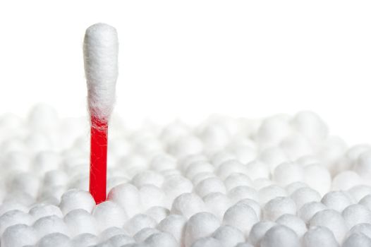 Q-tip stands out from the crowd of other on a white background