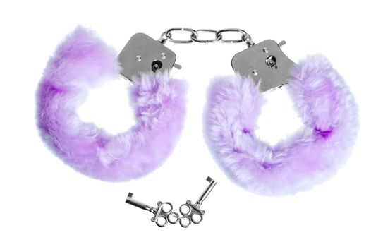 fur handcuffs with a key to love games on a white background