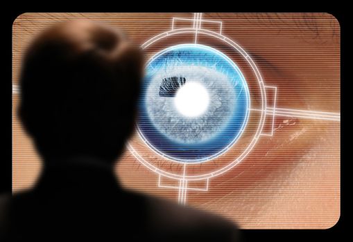 Man viewing a retinal eye scan on a video monitor Horizontal