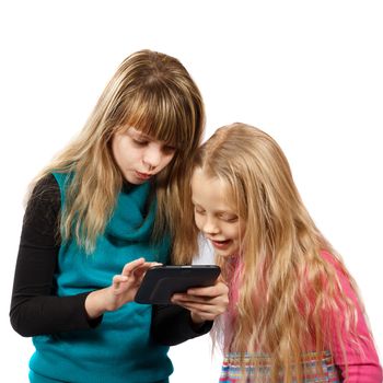 two girls looking at something in tablet PC on a white background