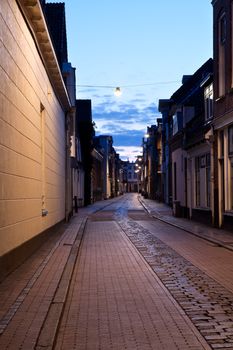 long street in Dutch city at night, Groningen, Netherlands