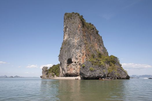 Small beach on Koh Nok, Phang Nga Bay, Thailand with boats