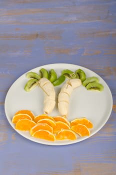 Tropical island made of fruit, a way to make healthy food attractive for kids