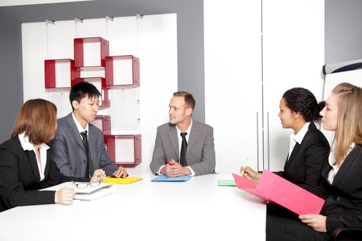 Confident partners sharing new ideas at meeting in conference room