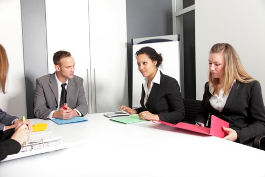 Group of business people having meeting in office