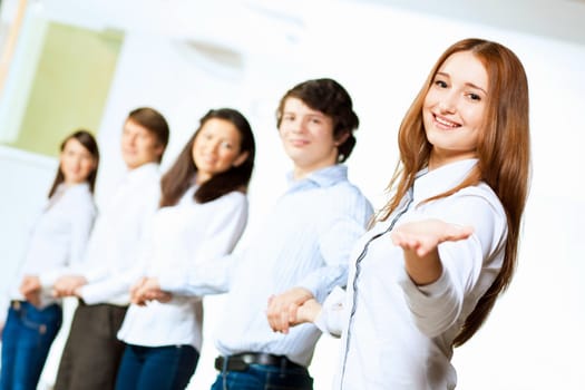 Image of five students in casual wear standing in row