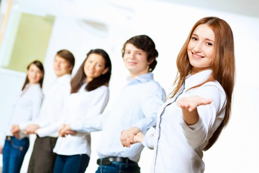 Image of five students in casual wear standing in row