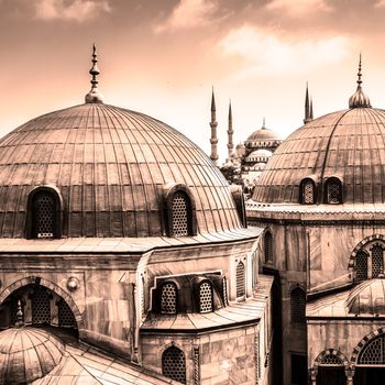 Blue Mosque or Sultan Ahmed Mosque viewed trough the window of Hagia Sophia, former Orthodox patriarchal basilica (church), later a mosque, and now a museum in Istanbul, Turkey.