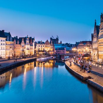 Picturesque medieval buildings overlooking the "Graslei harbor" on Leie river in Ghent town, Belgium, Europe.