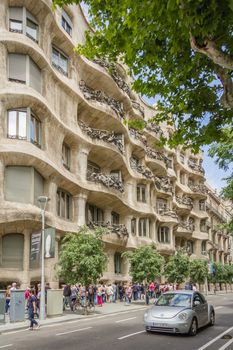 BARCELONA, SPAIN - MAY 31 View of the Casa Mila, better known as La Pedrera, designed by Antoni Gaudi, in Barcelona, Spain, on May 31, 2013. The building is the best exponent of modernist architecture