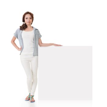 Attractive Asian woman stand with blank board of advertisement on white background.